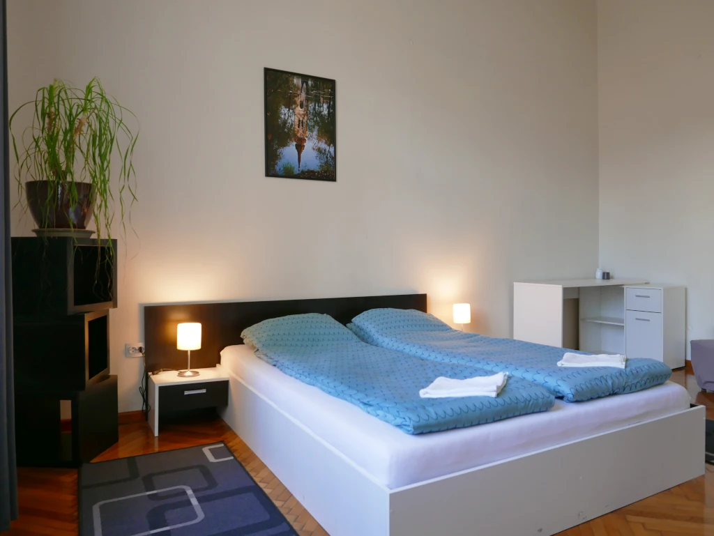 Comfortable master bedroom with a large double bed and fresh towels inside the private suite.