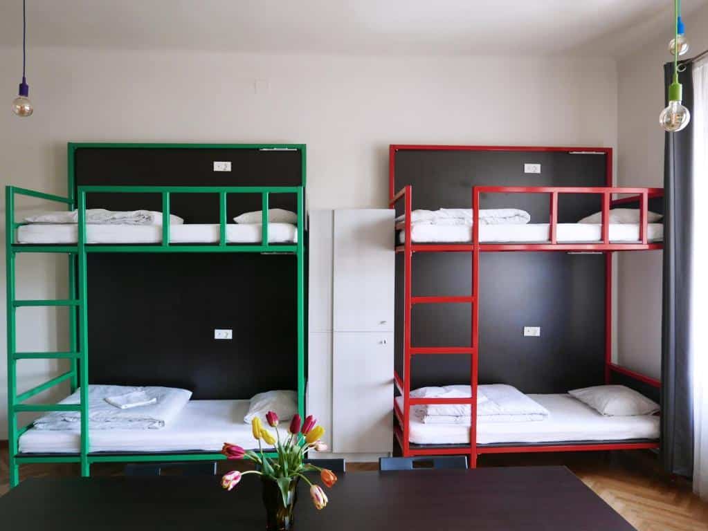 Beds with clean linen and towels at Choco Home & Hostel
